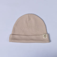 Oat beige beanie hat with Aneby windmill hem tag