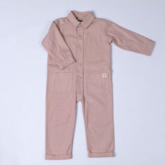 Product shot of the pink kids boilersuit with Aneby hem tag