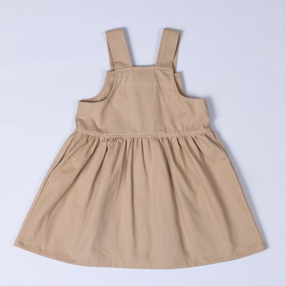 Back view of pleated dress in beige 