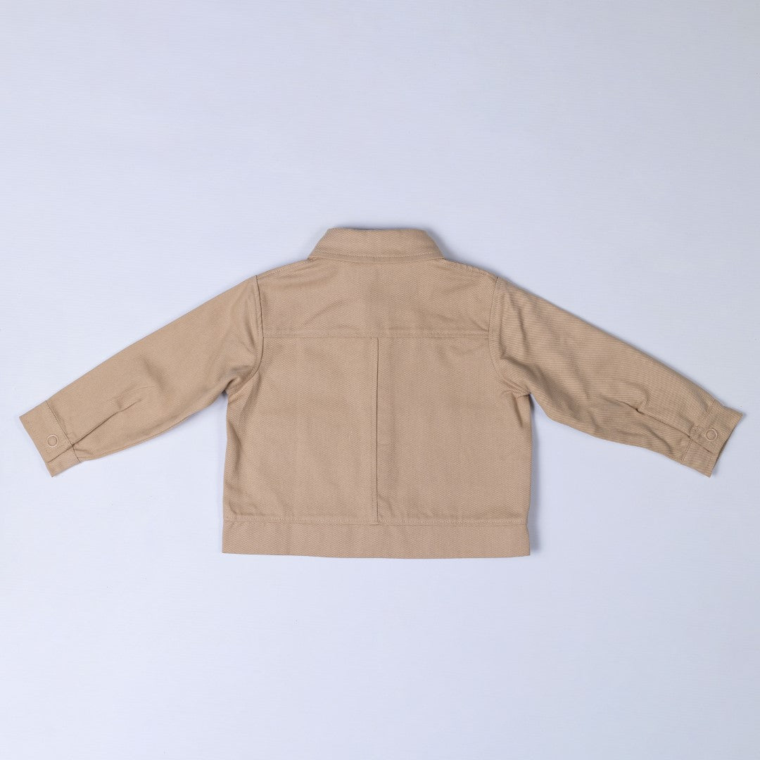 Back of Oat beige Aneby jacket with yoke and centre back seam, waistband and button up cuffs