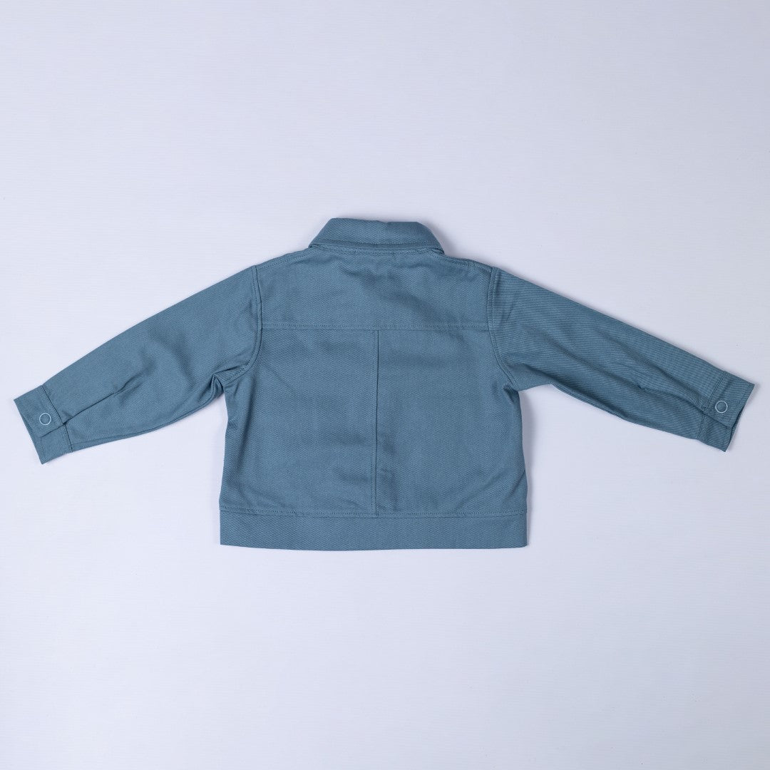 Back of slate blue Aneby jacket with yoke and centre back seam, waistband and button up cuffs