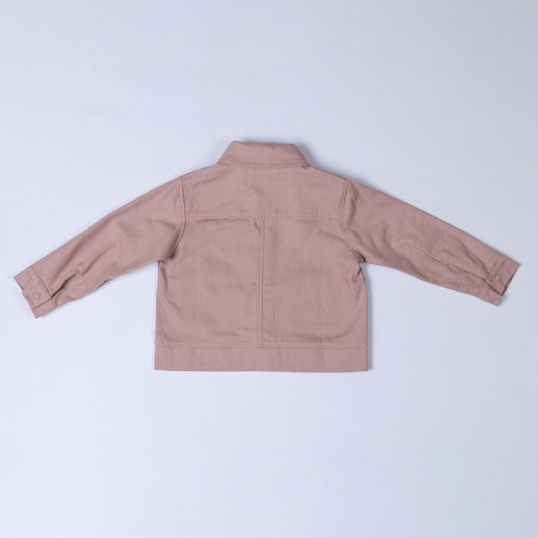 Back of dusty pink Aneby jacket with yoke and centre back seam, waistband and button up cuffs