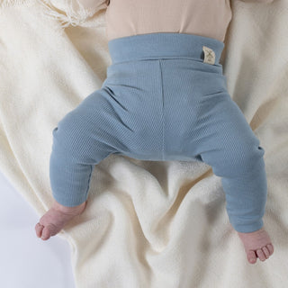 Slate blue jersey rib cotton leggings on baby with Aneby windmill hem tag on waistband