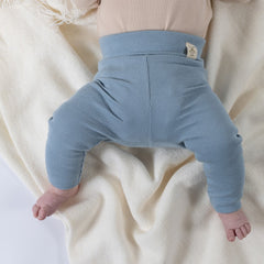 Slate blue jersey rib cotton leggings on baby with Aneby windmill hem tag on waistband