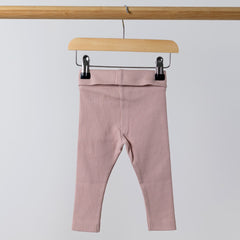 Rear view of baby pink rib leggings on wooden hanger