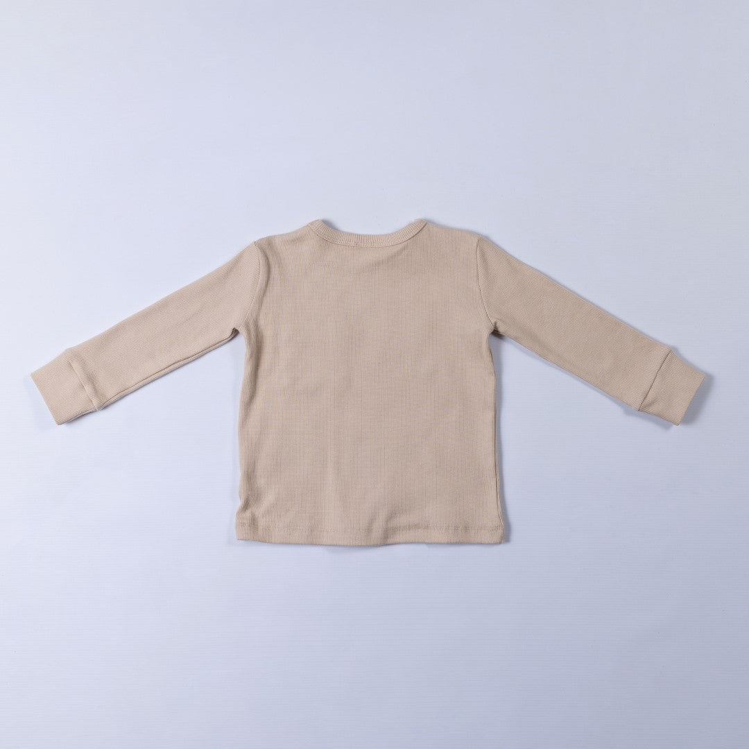 Rear image of neutral ecru long sleeve top with thick neck binding and cuffs