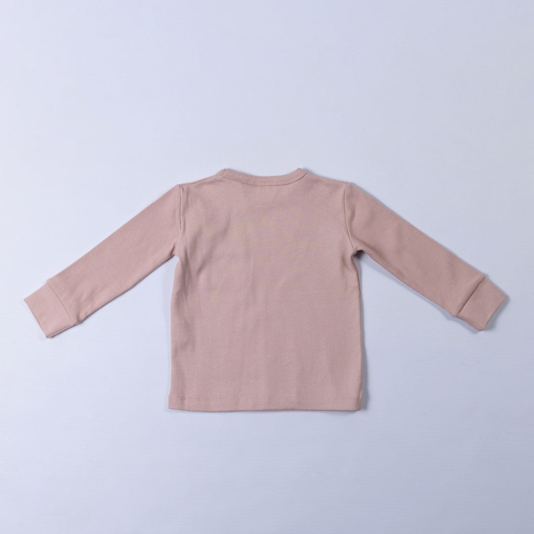 Rear image of dusty pink long sleeve top with thick neck binding and cuffs