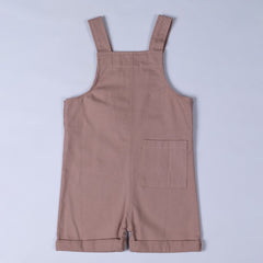 Back of pink Aneby dungaree shorts with shoulder straps and square patch pocket on back right leg