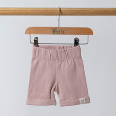 Pink shorts featuring Aneby logo with rolled hem