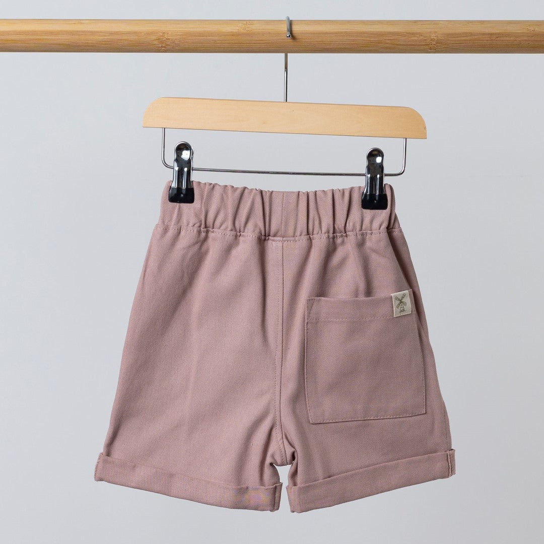 Back view of chino style pink shorts with patch pocket and Aneby windmill hem tag