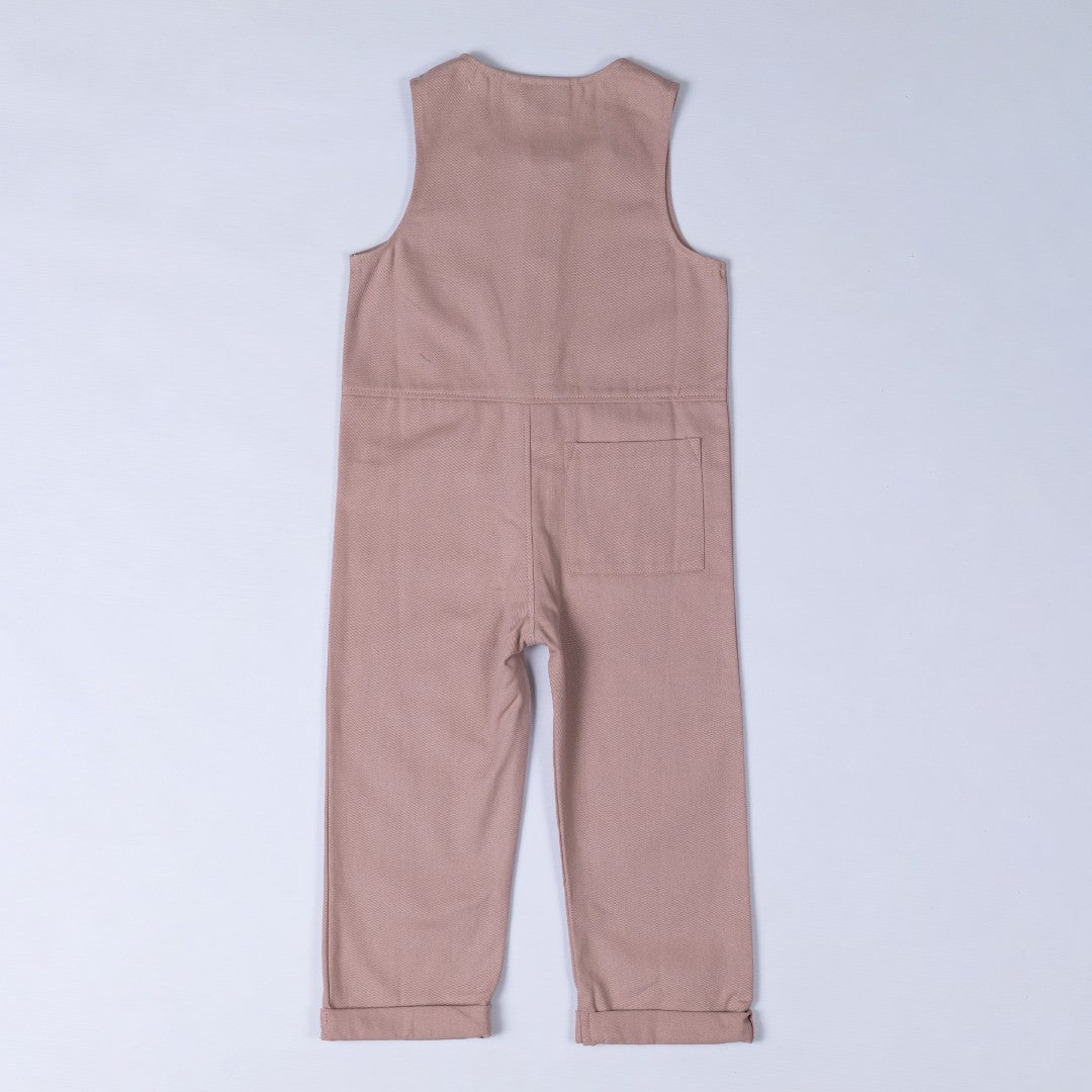 Rear view of twill sleeveless jumpsuit in soft pink with waist seam and square patch pocket