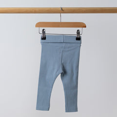 Back view of organic blue ribbed baby leggings, highlighting the ribbed texture and stitch work on the waistband. 