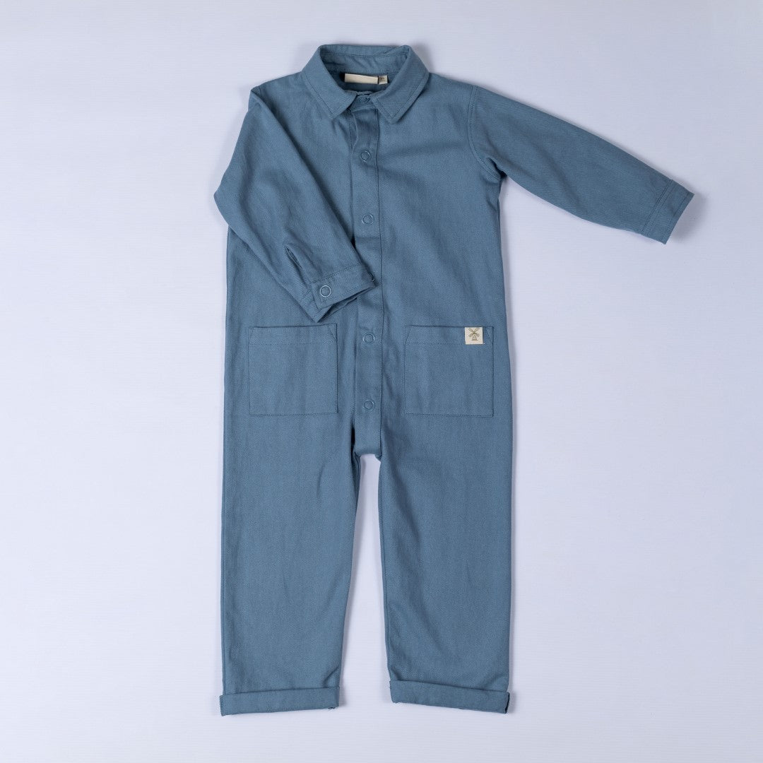 Slate blue twill kids boilersuit, front view, with classic workwear-inspired design.