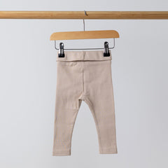 Back view of organic oat ribbed baby leggings, showcasing the ribbed texture and high-quality stitch work on the waistband. The soft fabric is ideal for babies' sensitive skin.