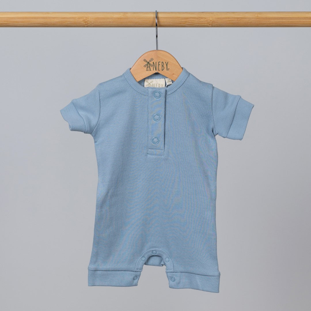 Slate blue short sleeve rib baby romper hanging, front view.