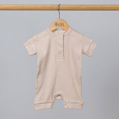 Oat short sleeve rib baby romper hanging, front view.